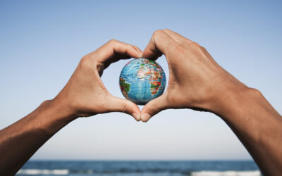 young man with a world globe in his hands