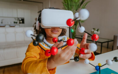 Girl using VR glasses holding molecular model