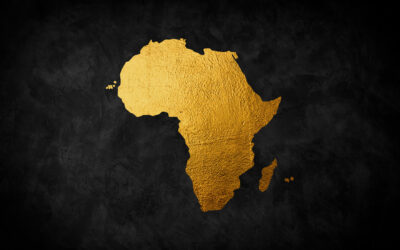 Africa continent shaped from golden glitter on a black background.