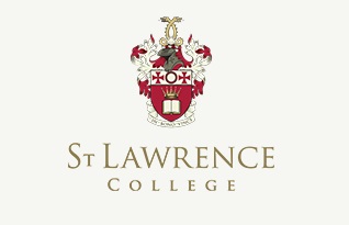 child with a soccer ball on pitch ISKL