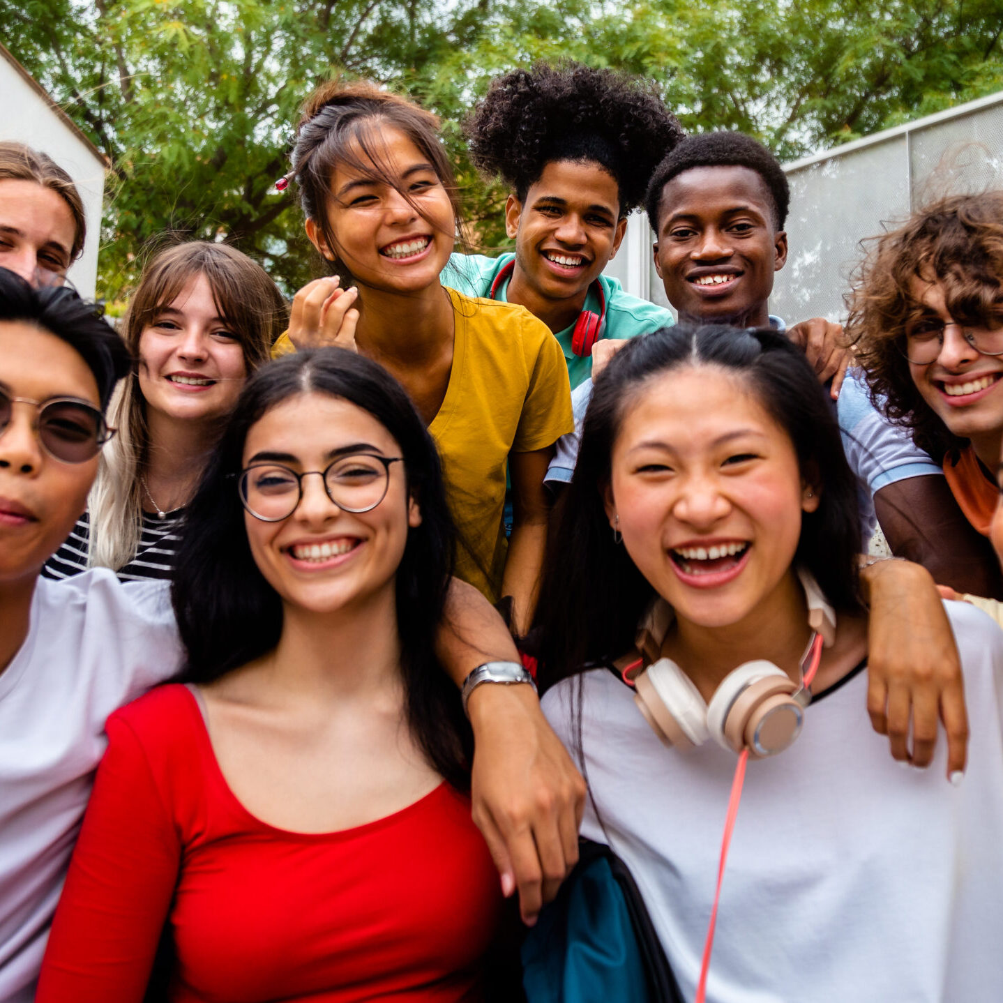 Group of happy and smiling multiracial university students looking at camera. High school students. International Education Schools Fair